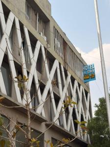 a building with a sign on the side of it at Hotel J K Town in Ahmedabad