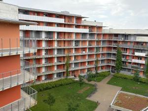 an apartment building with a courtyard in front of it at Cozy Apartment in Graz