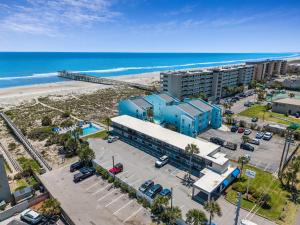 an aerial view of a building next to the beach at Beachside Motel - Amelia Island in Amelia Island