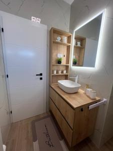 a bathroom with a sink and a mirror at Guest House Gabi in Srima +22 photos
