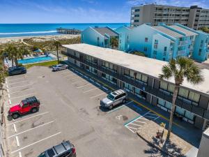 an aerial view of a hotel with a parking lot at Beachside Motel - Amelia Island in Amelia Island