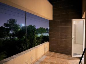 a balcony with a view of a building at Private villa in Lahore +2 photos