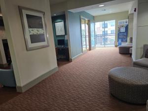 a lobby with a waiting room with a couch and chairs at Domain at Kirby in Houston