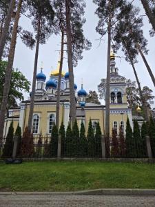 a building with blue domes on top of it at Baltic Beach Villa I in Jūrmala