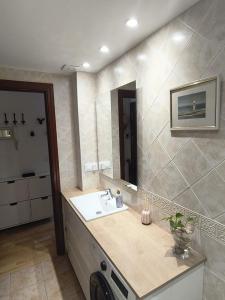 a bathroom with a sink and a mirror at Mirador de Cerler in Cerler +11 photos