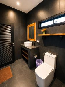 a bathroom with a toilet and a sink at Villa Ravenala in Chaweng in Ban Ko Khwan +21 photos