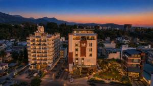 an aerial view of a city with buildings at Four Leaf Hotel Dehradun in Dehradun