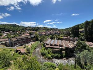 an aerial view of a village with a building at Escapade en Auvergne - centre historique - 3 personnes in Olliergues