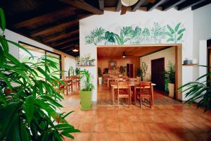 a dining room with a table and some plants at Hidden Valley Wilderness Lodge in Blancaneau