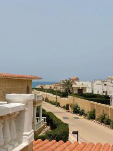 a view of a street from a balcony of a building at Dina Mansour's vacation home 54 A upper in Dawwār ‘Abd Allāh
