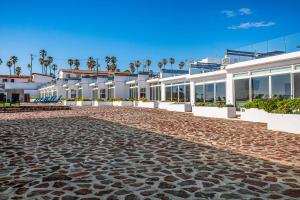a cobblestone street in front of a building at Dog-Friendly Villa with Heated Outdoor Pool, Hot Tub, Streaming, Partial Views in Rosarito