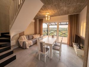 a living room with a table and a couch at Osada ŁYSKA in Żywiec