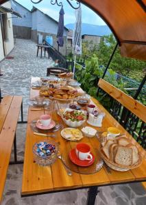 a table full of food on top of a table at Ana-Maria Bnb in Tatʼev