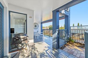 a balcony with a view of the ocean from a house at Poolside 2-Bed Apartment Near Coolangatta in Gold Coast