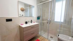 a bathroom with a sink and a shower at Appartamento LIBERTA, Liguria in Rapallo +14 photos