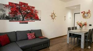a living room with a couch and a dining room table at Appartamento LIBERTA, Liguria in Rapallo