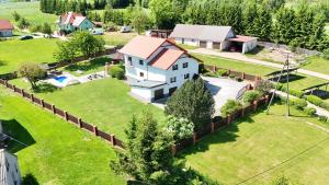 an aerial view of a house with a fence at Słoneczny dom w górach, Sauna, basen Karpacz Opawa in Lubawka