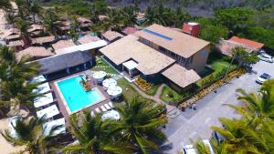 an aerial view of a house with a swimming pool at Pousada Ponta de Areia in Prado