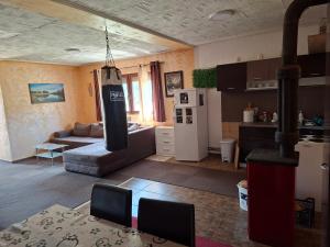 a kitchen and a living room with a kitchen and a living room at Ribnica in Ribnica