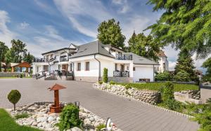 a rendering of a house with a driveway at Villa Bellevue Wellness in Liptovský Mikuláš