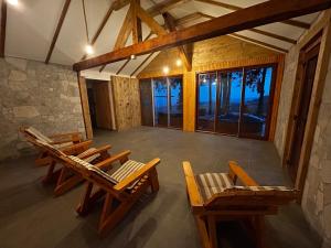 an overhead view of a room with chairs and windows at Tiarra Mountain Lodge in Beliş