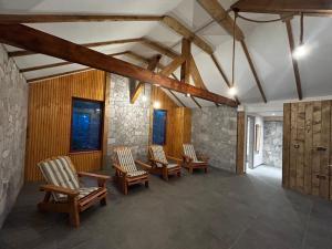 a room with chairs and a table in a building at Tiarra Mountain Lodge in Beliş +51 photos