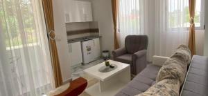 a living room with a couch and a table at Maxhuri Apartments in Ulcinj