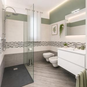 a bathroom with a shower and a toilet and a sink at Sa lampana in Orosei +11 photos