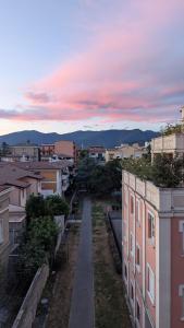 a view of a city at sunset with buildings at ANDREA - Chiassi in Brescia