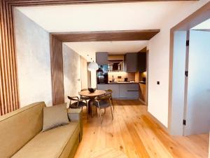 a living room with a couch and a table at Apartman 206 in Jahorina
