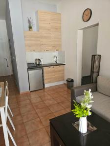 a living room with a couch and a table at Apartament Sorrento Paradise in Marina Cape in Aheloy