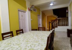 a dining room with a large table and chairs at Crossroad in Shillong