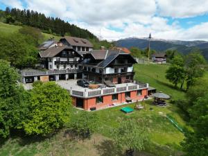 an aerial view of a large house on a hill at Hansbauer Appartments in Gmünd in Kärnten