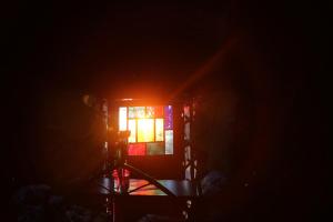 a room with a window with the light coming in at The Shangri La Sunset Yurt in Tenbury