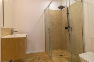 a bathroom with a shower and a sink at villa avec piscine in Hendaye