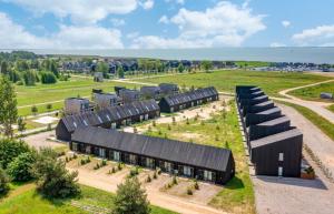 an overhead view of a building with black roofs at Sunset House Svencele in Svencelė