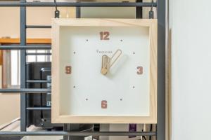 a clock on a rack in a room at Atlantis Tengachaya - Whole house rental in Osaka
