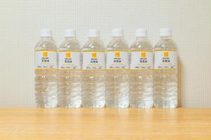 a group of bottles of water sitting on a table at Atlantis Tengachaya - Whole house rental in Osaka +63 photos