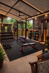 a gym with several equipment in a room at Wilpattu Green Cabin in Achchamulai