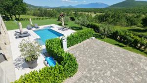 an aerial view of a villa with a swimming pool at Villa Vitrenik, Cista Velika, Makarska-Imotski in Velika Cista
