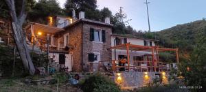 a house with lights on the side of it at La quiete accesa in Vernazza
