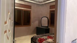 a room with a mirror and a bed in a room at marrakesh Big house in Marrakesh