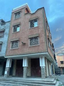 a building with four windows on the side of it at marrakesh Big house in Marrakesh