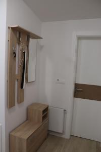 a room with a wooden stair case and a door at Bjelašnica Escape in Bjelašnica