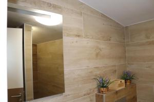 a bathroom with a shower and a large mirror at Bjelašnica Escape in Bjelašnica +5 photos