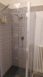 a bathroom with a shower with a glass door at Casa Mare Blu in Imperia +35 photos