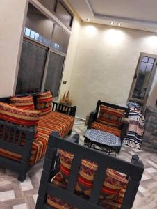 a living room with two couches and a couch at Villa Nono & Zac Marrakech in Ourika +2 photos
