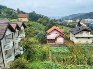 a group of houses on a hill in a village at Ilidza Heart of the nature by Armin in Slivlje