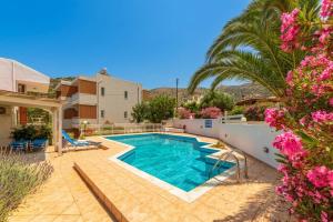a swimming pool in the backyard of a house at Elia serenity apartment 4 in Mesochórion