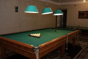 a pool table with a ball in a room at Abelyans Fam Hotel in Alaverdi